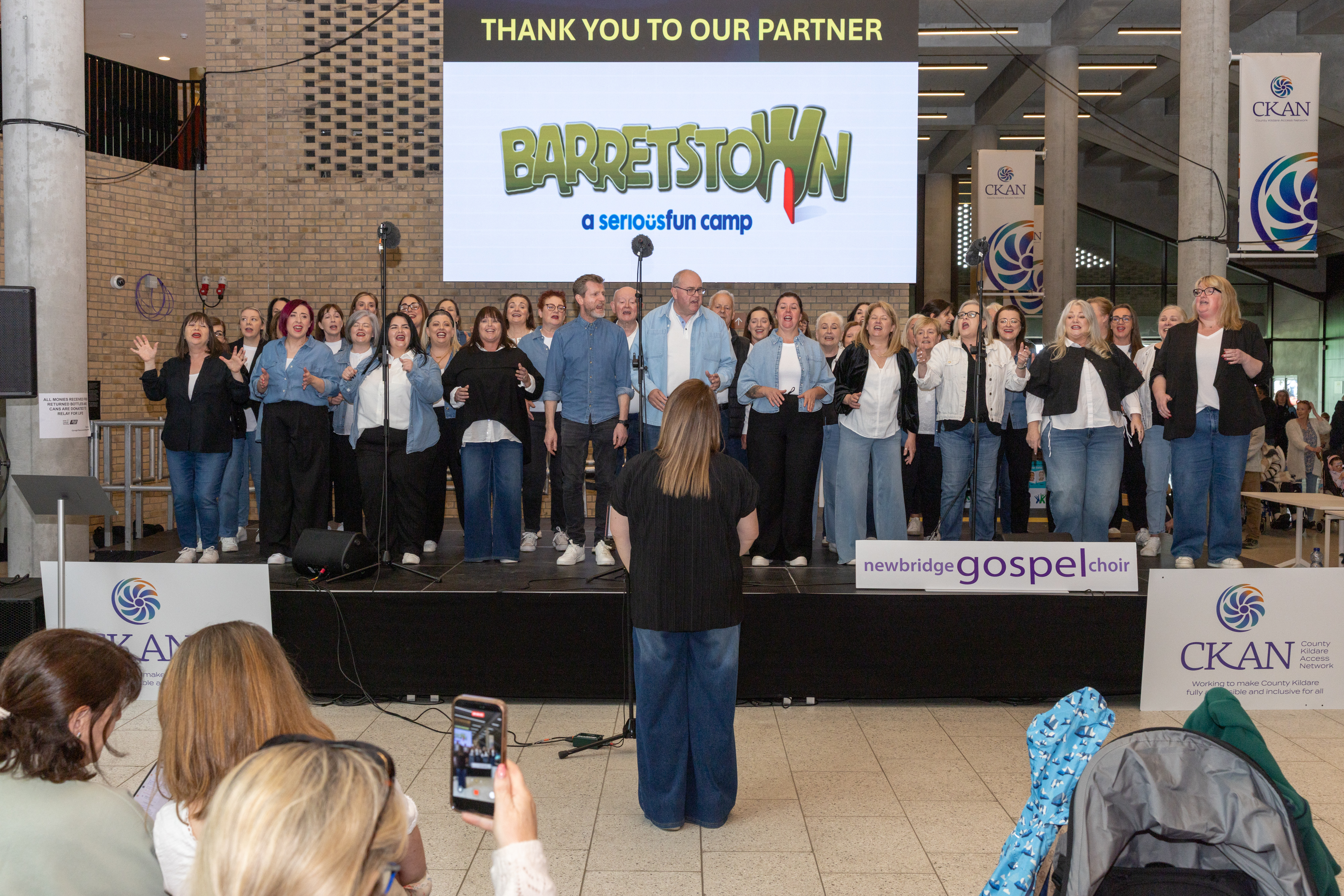 Group on stage singing.